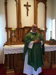 Father Richard in front of the altar